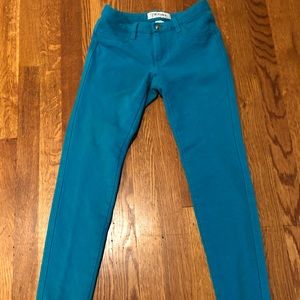 Aqua green stretch skinny jeans. Very slimming.